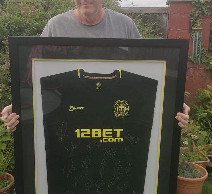 £600k reached and win a framed signed FA Cup winning shirt